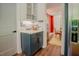 Charming kitchen nook with blue cabinets, subway tile backsplash and modern lighting at 7955 Midnight Ln, Wake Forest, NC 27587