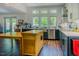 Bright kitchen with stainless steel appliances, farmhouse sink, and spacious countertops at 7955 Midnight Ln, Wake Forest, NC 27587