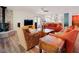 Beautiful living room offering hardwood floors, fireplace, and a view into the bright kitchen at 7955 Midnight Ln, Wake Forest, NC 27587
