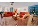 Bright and airy living room and kitchen offer a seamless transition, with hardwood floors and plenty of natural light at 7955 Midnight Ln, Wake Forest, NC 27587