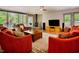 Comfortable living room featuring fireplace, plush seating, and seamless indoor-outdoor flow at 7955 Midnight Ln, Wake Forest, NC 27587