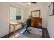 Bright office space featuring a ceiling fan, a large window, hardwood floors, and an area rug at 7955 Midnight Ln, Wake Forest, NC 27587