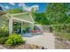 Outdoor patio area featuring comfortable seating and lush landscaping, ideal for relaxing outdoors at 7955 Midnight Ln, Wake Forest, NC 27587