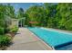 Lovely backyard pool and seating area offering a perfect outdoor space for relaxation and entertainment at 7955 Midnight Ln, Wake Forest, NC 27587