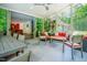 Spacious sunroom featuring a dining area, cozy lounge space, and sliding glass doors to the outdoors at 7955 Midnight Ln, Wake Forest, NC 27587