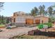 New construction shows block foundation, wood beams and exterior progress amidst a verdant landscape at 7961 Wexford Waters Ln, Wake Forest, NC 27587