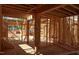 The house framing shows interior wood stud walls and support beams detail of new home construction at 7961 Wexford Waters Ln, Wake Forest, NC 27587