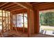 Interior framing shows wood stud walls, large windows, and natural light at 7961 Wexford Waters Ln, Wake Forest, NC 27587