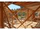 Wood beams and wall studs are displayed throughout the interior framing and support construction of new home at 7961 Wexford Waters Ln, Wake Forest, NC 27587