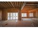 Spacious unfinished living area with sliding glass doors and ample windows at 7961 Wexford Waters Ln, Wake Forest, NC 27587