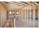 Unfinished interior space with exposed framing and staircase access at 7961 Wexford Waters Ln, Wake Forest, NC 27587