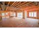 Unfinished living room with exposed framing and natural light at 7961 Wexford Waters Ln, Wake Forest, NC 27587