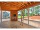 Future sunroom with exposed wooden framing and walls of windows framing the backyard view at 7961 Wexford Waters Ln, Wake Forest, NC 27587