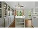 Eat-in kitchen dining area featuring built-in shelving and an island with barstool seating at 8 Bluebell Ct, Durham, NC 27713