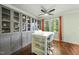 Bright eat-in kitchen dining area featuring built-in shelving and an island with barstool seating at 8 Bluebell Ct, Durham, NC 27713