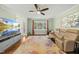 Living room featuring hardwood floors, a fireplace, and a large window at 8 Bluebell Ct, Durham, NC 27713