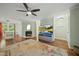 Cozy living room with fireplace, hardwood floors and large windows at 8 Bluebell Ct, Durham, NC 27713