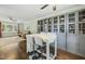 Bright living room featuring built-in shelving and an island with barstool seating at 8 Bluebell Ct, Durham, NC 27713