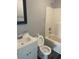 Bathroom features white fixtures and storage in a vanity at 801 E Highland Ave, Rocky Mount, NC 27801