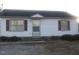 Charming single story home with a dark roof and white siding at 801 E Highland Ave, Rocky Mount, NC 27801
