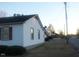 Charming single story home with a dark roof and white siding near a street at 801 E Highland Ave, Rocky Mount, NC 27801