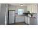 Cozy kitchen features white cabinets, modern appliances, and lots of light at 801 E Highland Ave, Rocky Mount, NC 27801