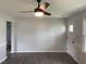 Open-concept living room boasts modern ceiling fan, wood plank flooring and natural light at 83 Brentwood Dr, Selma, NC 27576