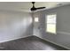 Bright living room featuring wood plank flooring, a new door and a large window at 83 Brentwood Dr, Selma, NC 27576