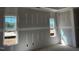 Bedroom featuring newly installed drywall and dual windows offering views and natural light at 871 Olive Branch Dr, Smithfield, NC 27577