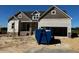 Exterior of a newly constructed house, features siding, brick accents, and an attached two-car garage at 871 Olive Branch Dr, Smithfield, NC 27577