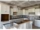 Spacious kitchen features white cabinets, granite countertops, and a large center island at 871 Olive Branch Dr, Smithfield, NC 27577