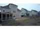 Home featuring a screened porch, large backyard space, and proximity to neighboring homes at 901 Hollymont Dr, Holly Springs, NC 27540