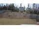 Expansive backyard with lush greenery, a privacy fence, and a playset, perfect for outdoor activities at 901 Hollymont Dr, Holly Springs, NC 27540