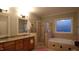 This bathroom features dual sinks, a tiled shower, and a separate soaking tub at 901 Hollymont Dr, Holly Springs, NC 27540