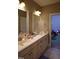 Bathroom featuring a double sink vanity with marble countertop at 901 Hollymont Dr, Holly Springs, NC 27540