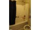 Bathroom with a shower and tub combination and neutral color scheme at 901 Hollymont Dr, Holly Springs, NC 27540