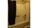 Bathroom with a shower and tub combination and neutral color scheme at 901 Hollymont Dr, Holly Springs, NC 27540