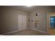 Bedroom with neutral walls, a closet, and adjacent room view at 901 Hollymont Dr, Holly Springs, NC 27540