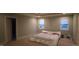 Bedroom with a unique bed frame, neutral carpet, and windows providing natural light at 901 Hollymont Dr, Holly Springs, NC 27540