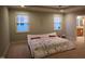 This bedroom offers recessed lighting, neutral carpet, and great natural light from large windows at 901 Hollymont Dr, Holly Springs, NC 27540