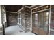Charming front porch with stone accents, double doors, and wood ceiling at 901 Hollymont Dr, Holly Springs, NC 27540
