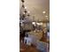 A well lit gourmet kitchen with granite countertops, stainless steel appliances, and a spacious center island at 901 Hollymont Dr, Holly Springs, NC 27540