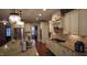 Gourmet kitchen featuring granite countertops, stainless steel appliances and custom white cabinets at 901 Hollymont Dr, Holly Springs, NC 27540