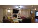 Spacious living room with fireplace, built-in shelves, and hardwood floors throughout the space at 901 Hollymont Dr, Holly Springs, NC 27540