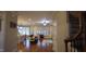 Bright open living room with hardwood floors, large windows, and a view of the staircase at 901 Hollymont Dr, Holly Springs, NC 27540