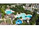 Aerial view of community pools and clubhouse surrounded by greenery and residential homes at 91 Cliffdale Rd, Chapel Hill, NC 27516