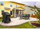 Lovely backyard with a screened porch, patio set, grill, and fresh landscaping around the property at 91 Cliffdale Rd, Chapel Hill, NC 27516