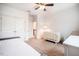 Another angle of the bright bedroom with a daybed, a crib, and a dresser at 91 Cliffdale Rd, Chapel Hill, NC 27516