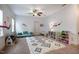 Playful bedroom showcasing a geometric rug, ' furniture, and a cozy seating area at 91 Cliffdale Rd, Chapel Hill, NC 27516