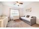 Bright bedroom with a daybed, a crib, and a dresser at 91 Cliffdale Rd, Chapel Hill, NC 27516